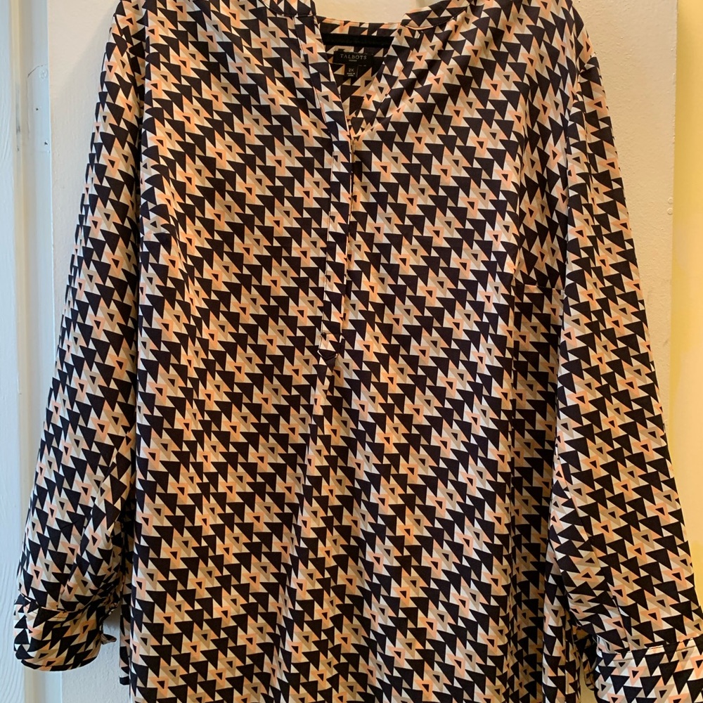 Long sleeve, loosely fitted blouse.